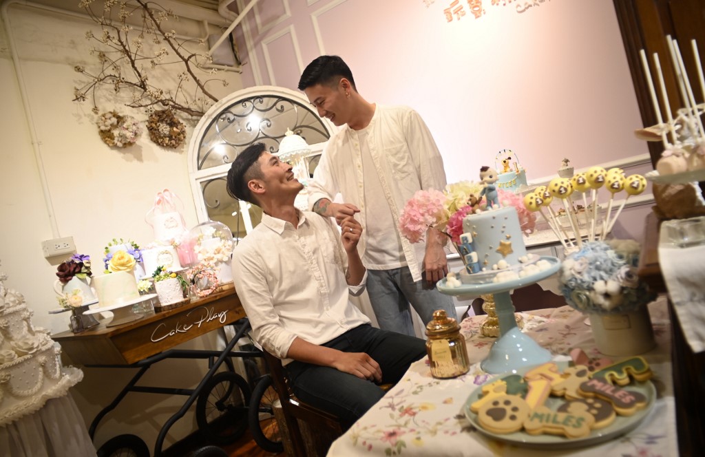 This picture taken on May 7, 2019 shows cake maker Shane Lin (L) and his lover Marc Yuan posing for a photo during an interview at their workshop Cake Play in Taipei. (Photo by SAM YEH / AFP) / TO GO WITH STORY: Taiwan-politics-rights-gay-marriage, FOCUS by Amber Wang
