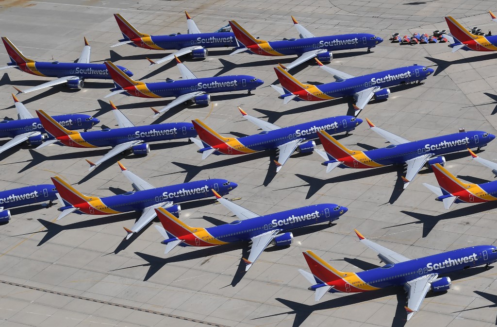 (FILES) In this file photo taken on March 28, 2019 Southwest Airlines Boeing 737 MAX aircraft are parked on the tarmac after being grounded, at the Southern California Logistics Airport in Victorville, California. - Boeing acknowledged on May 18, 2019 that it had to correct defects in its flight simulator software used to train pilots to fly the 737 MAX, the aircraft model involved in two deadly crashes that killed 346 people. (Photo by Mark RALSTON / AFP)