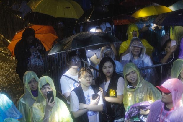 Otso Diretso supporters in the rain - UP Sunken Garden