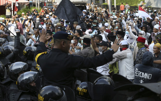  Protesters clash with Indonesian police after election loss