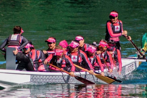 Breast cancer survivor paddles for gold as dragon boat member
