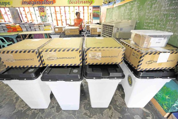 UNENDING SCRUTINY A batch of Smartmatic vote-counting machines awaits voters inside a classroom at President Corazon Aquino Elementary School in Batasan Hills, Quezon City on May 13. President Duterte has called on the Commission on Elections to ditch Smartmatic for another technology provider “free of fraud” in time for the 2022 presidential elections. —NIÑO JESUS ORBETA