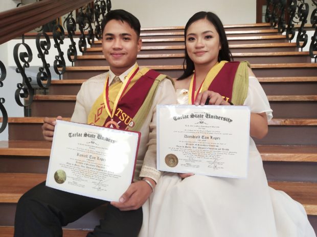 Twins defy poverty to graduate cum laude in Tarlac