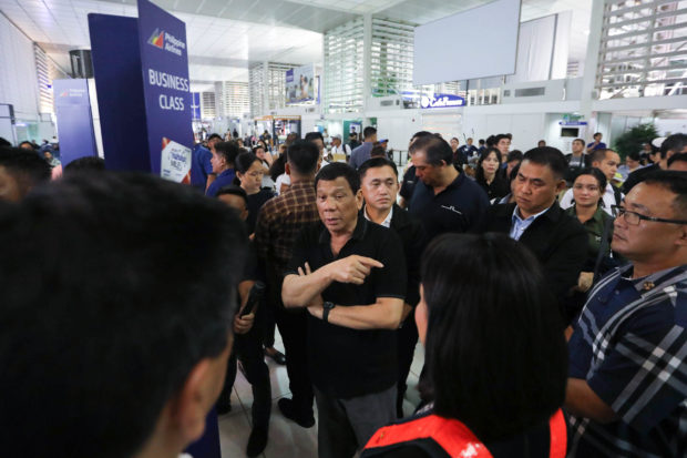duterte inspects naia 2, apologizes for flight woes