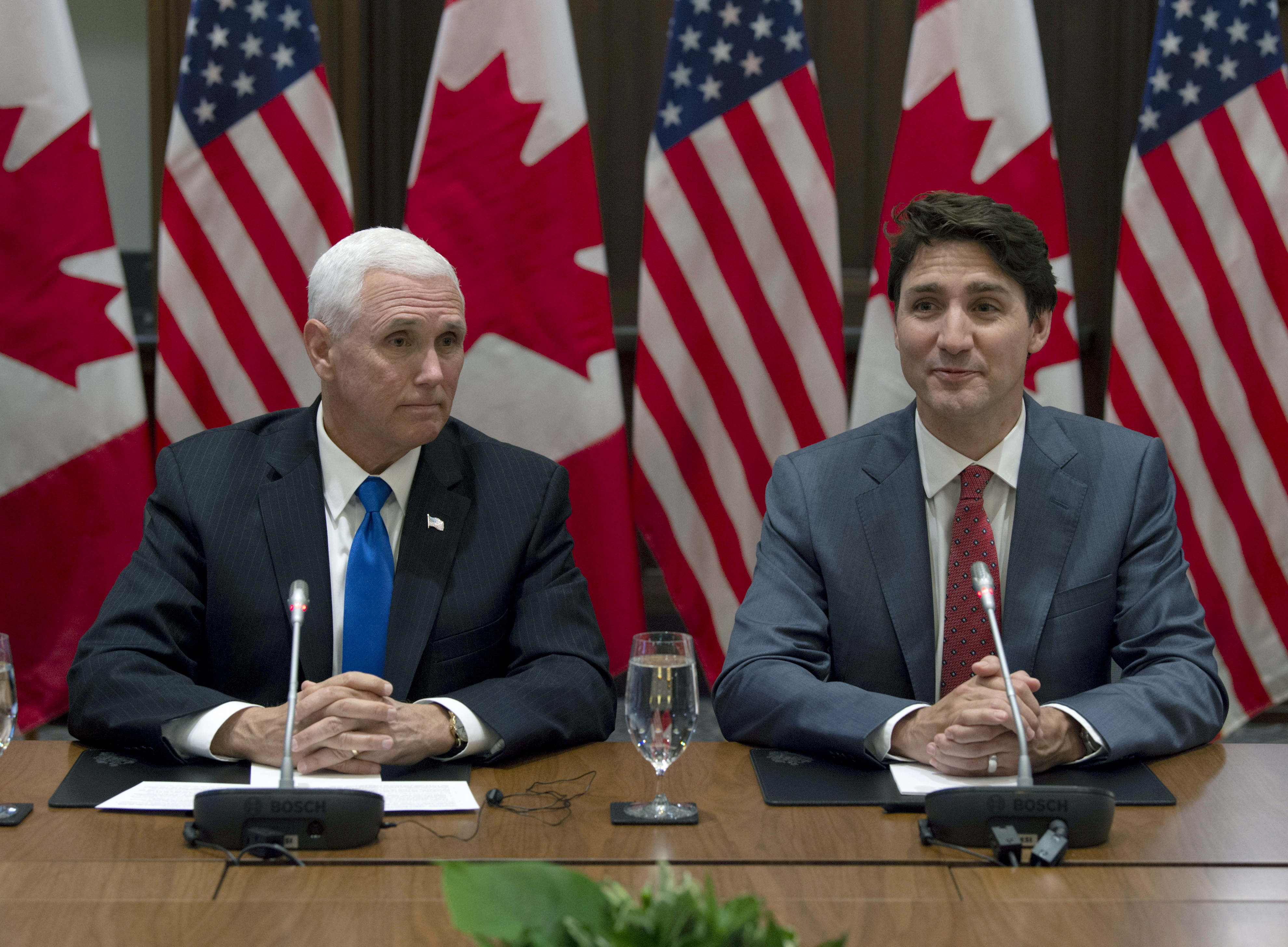 Canadian Prime Minister Justin Trudeau, right, and U.S. Vice President Mike Pence wait for the Canadian Council for the United States–Mexico–Canada Agreement meeting to begin on Parliament Hill in Ottawa, Ontario, Thursday, May 30, 2019. (Adrian Wyld/The Canadian Press via AP)