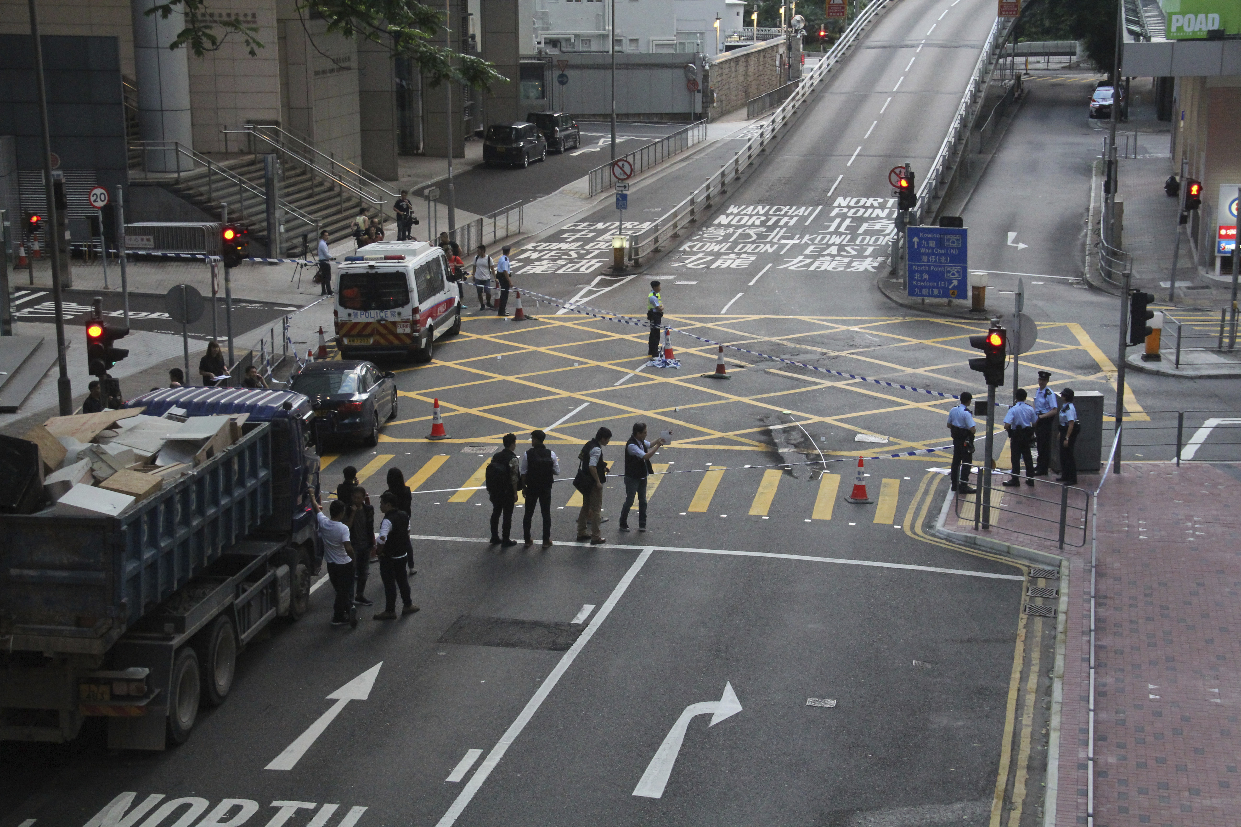 Hong Kong arrests 4 after bombs set off near police