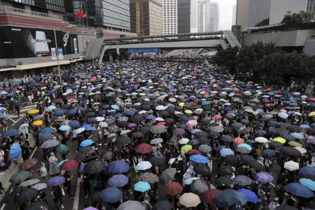  Hong Kong delays bill debate as protest crowds amass at HQ