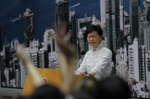  Hong Kong leader delays unpopular bill; activists want more