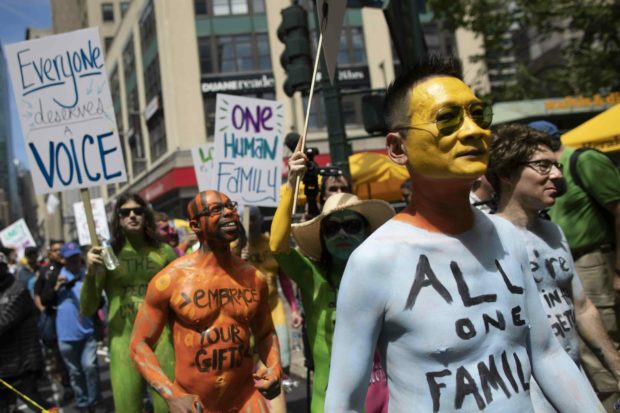  Protesters strip, get painted in Times Square