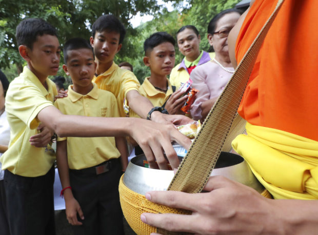 Thai cave boys mark year since ordeal with Buddhist rites