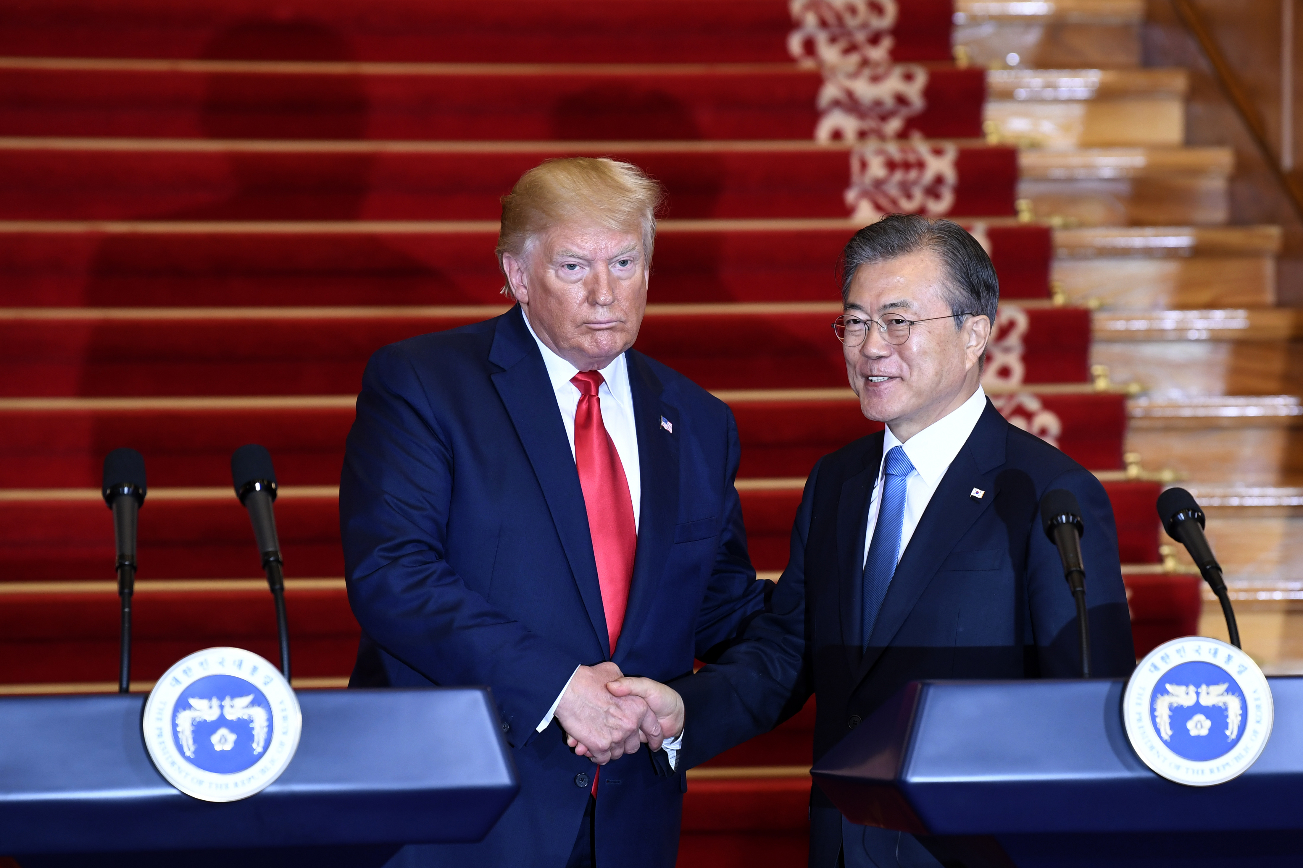 President Donald Trump, left, and South Korean President Moon Jae-in shake hands following their news conference at the Blue House in Seoul, Sunday, June 30, 2019. (AP Photo/Susan Walsh)