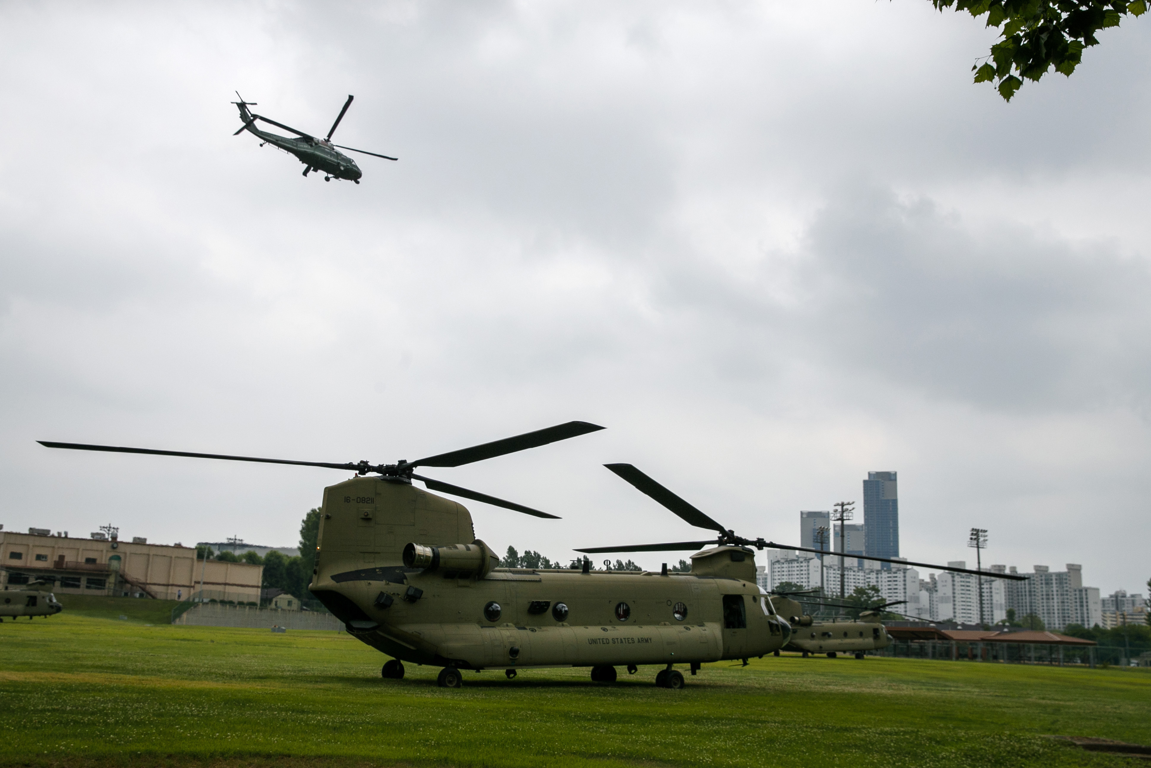 The Marine One helicopter, top, carrying President Donald Trump to the demilitarized zone (DMZ) takes off from Seoul, South Korea, Sunday, June 30, 2019, as a staff helicopter prepares en route to the DMZ. (AP Photo/Jacquelyn Martin, Pool)