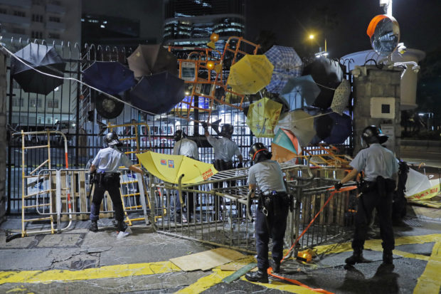 Hong Kong protesters push ahead as territory's leader unseen