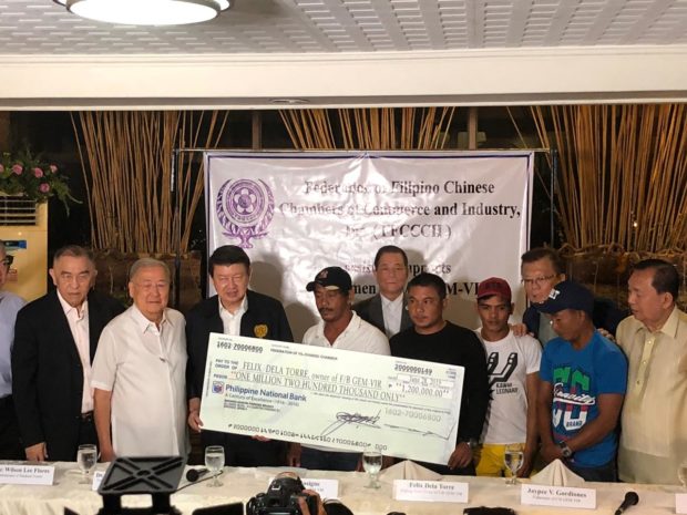 Fishermen get aid from Filipino-Chinese group with 'no strings attached'