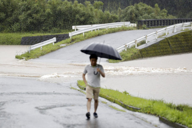 Two dead as Japan orders 670,000 to flee heavy rains