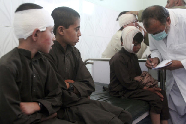 Injured boys in Afghanistan car bombing