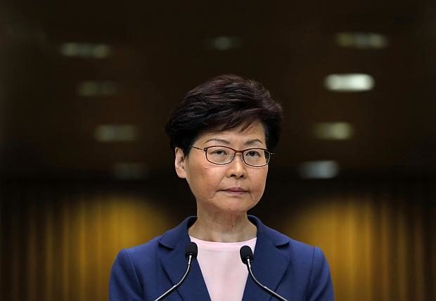 Hong Kong leader grilled at press conference