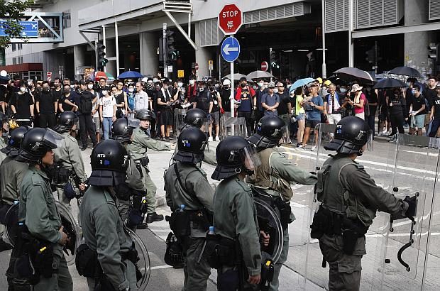 Protesters face Hong Kong police
