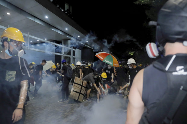Riot police clear away protests from Hong Kong legislature