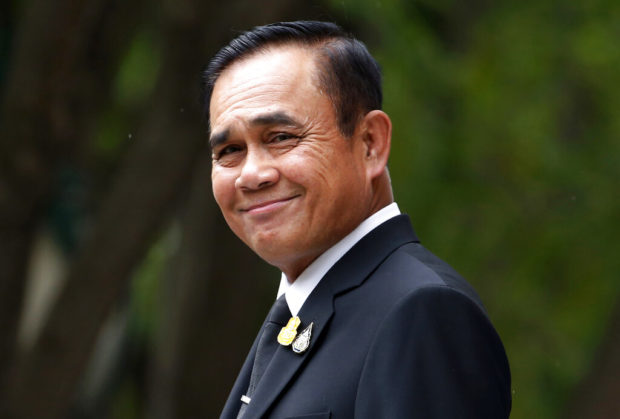 Thai PM revokes some junta orders before heading new gov't