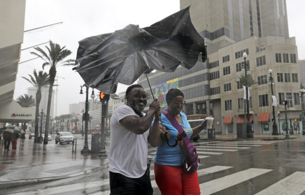 Barry crawls ashore in Louisiana, weakens to tropical storm