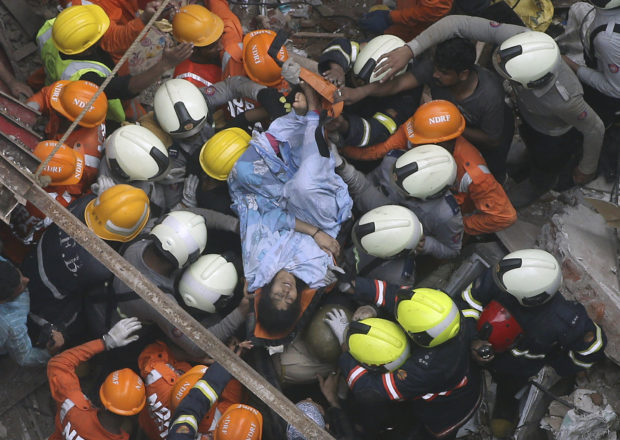 Rescuers find 14 bodies after building collapse in India