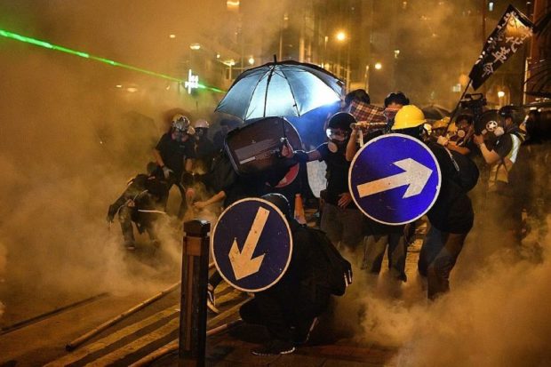 Tear gas fills streets of Hong Kong as anger rages