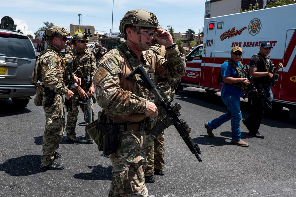 Law enforcement agencies respond to an active shooter at a Wal-Mart near Cielo Vista Mall in El Paso, Texas, Saturday, Aug. 3, 2019. - Police said there may be more than one suspect involved in an active shooter situation Saturday in El Paso, Texas. City police said on Twitter they had received "multi reports of multipe shooters." There was no immediate word on casualties. (Photo by Joel Angel JUAREZ / AFP) texas shooting