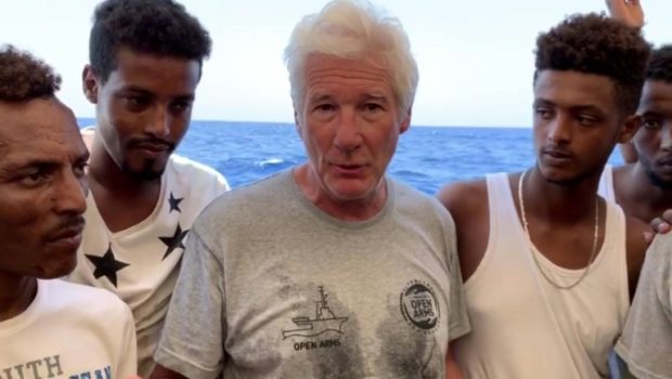 Richard Gere with African migrants