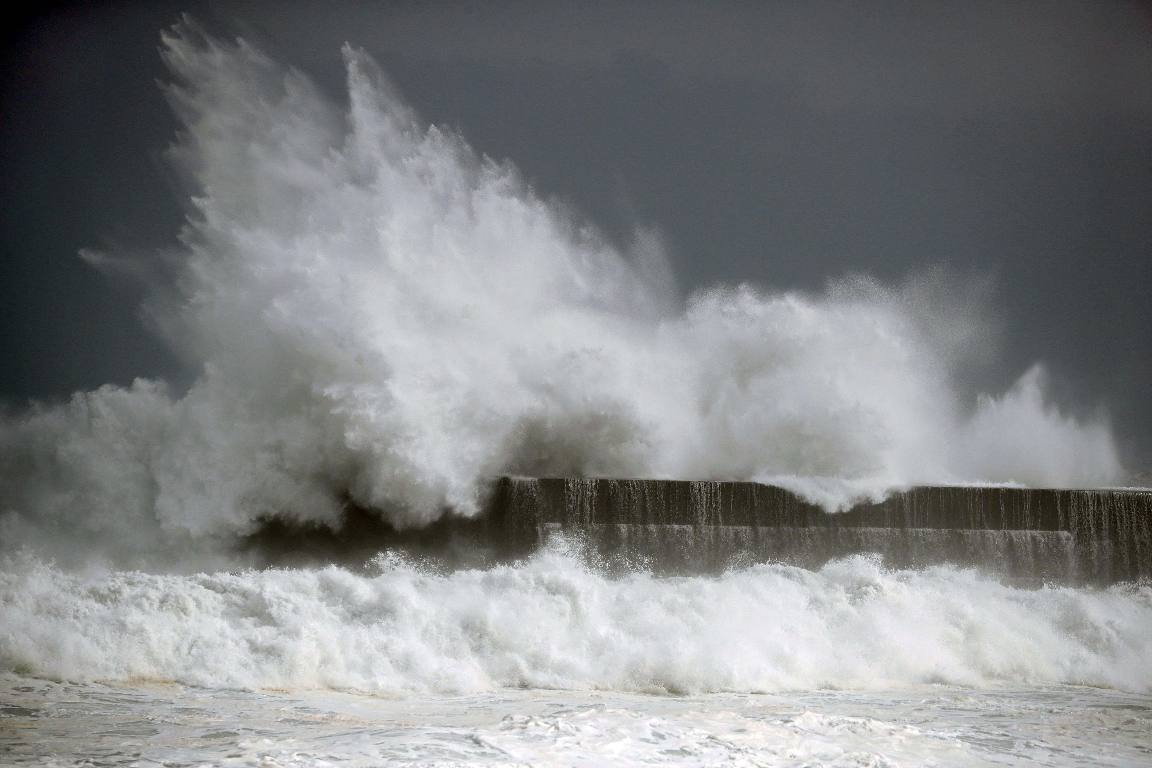 In this Wednesday, Aug. 14, 2019, photo, high waves hit a fishing port in Kochi, southwestern Japan as a powerful typhoon Krosa approaches southern and western Japan. (Suo Takekuma/Kyodo News via AP)