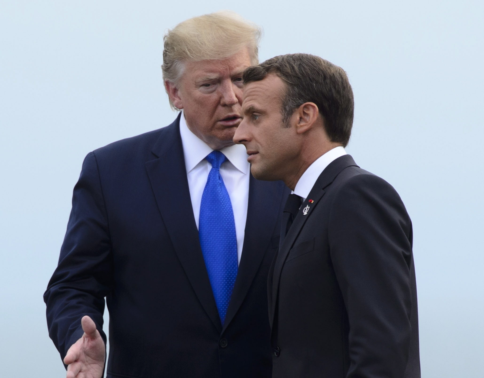 U.S. President Donald Trump, left, is greeted by the President of France Emmanuel Macron as he arrives to the G7 Summit in Biarritz, France, Saturday, Aug. 24, 2019. (Sean Kilpatrick/The Canadian Press via AP)