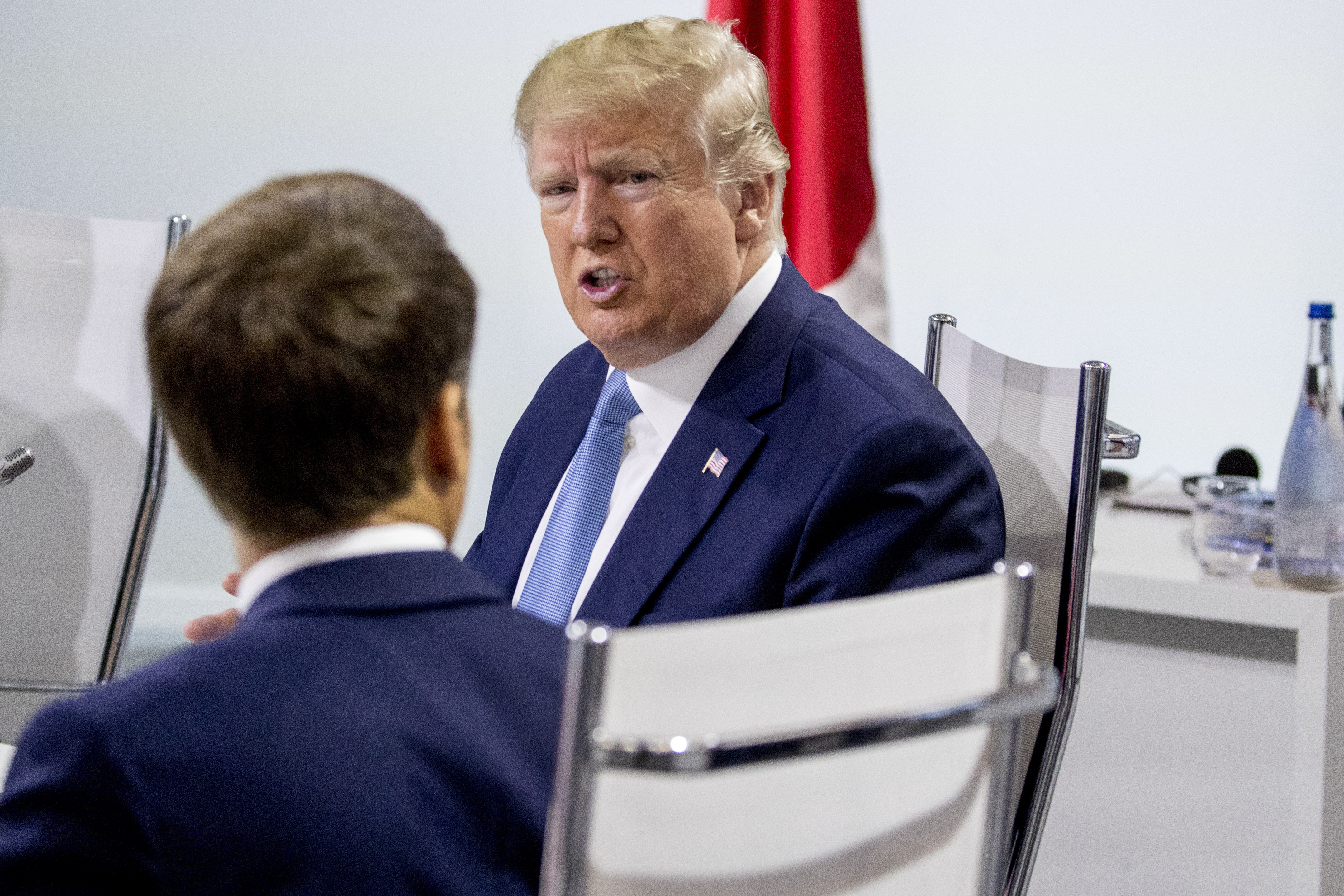 French President Emmanuel Macron, left, and President Donald Trump, right, participate in a G-7 Working Session on the Global Economy, Foreign Policy, and Security Affairs the G-7 summit in Biarritz, France, Sunday, Aug. 25, 2019. (AP Photo/Andrew Harnik, Pool)