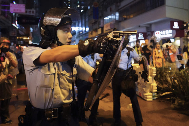  Hong Kong police draw guns, arrest 36 from latest protest