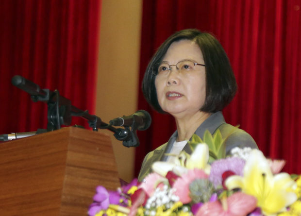 Taiwan leader touts island's determination to defend itself