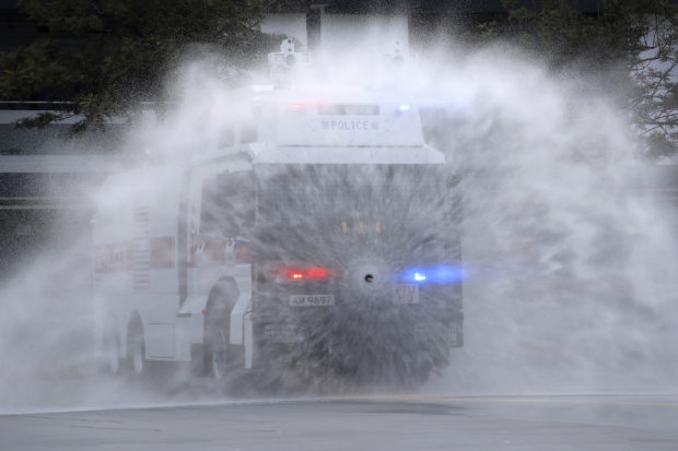 Hong Kong police demonstrate water cannon as protests linger