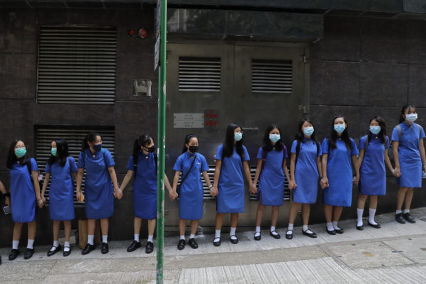 Hong Kong tells US to stay out; students form protest chains