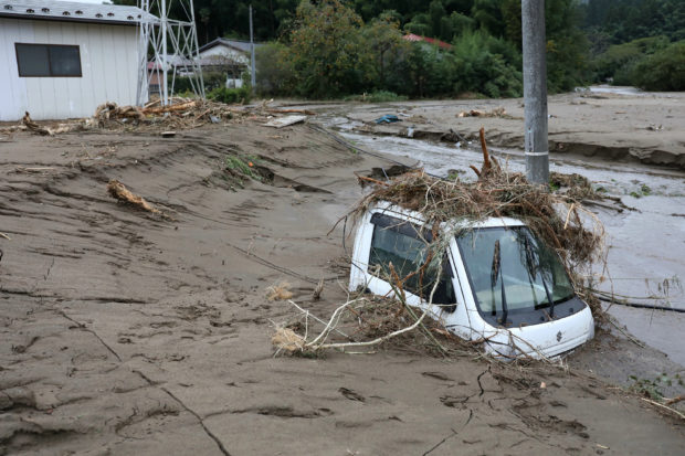             58 dead, rescuers in 'day and night' hunt for missing after Japan typhoon