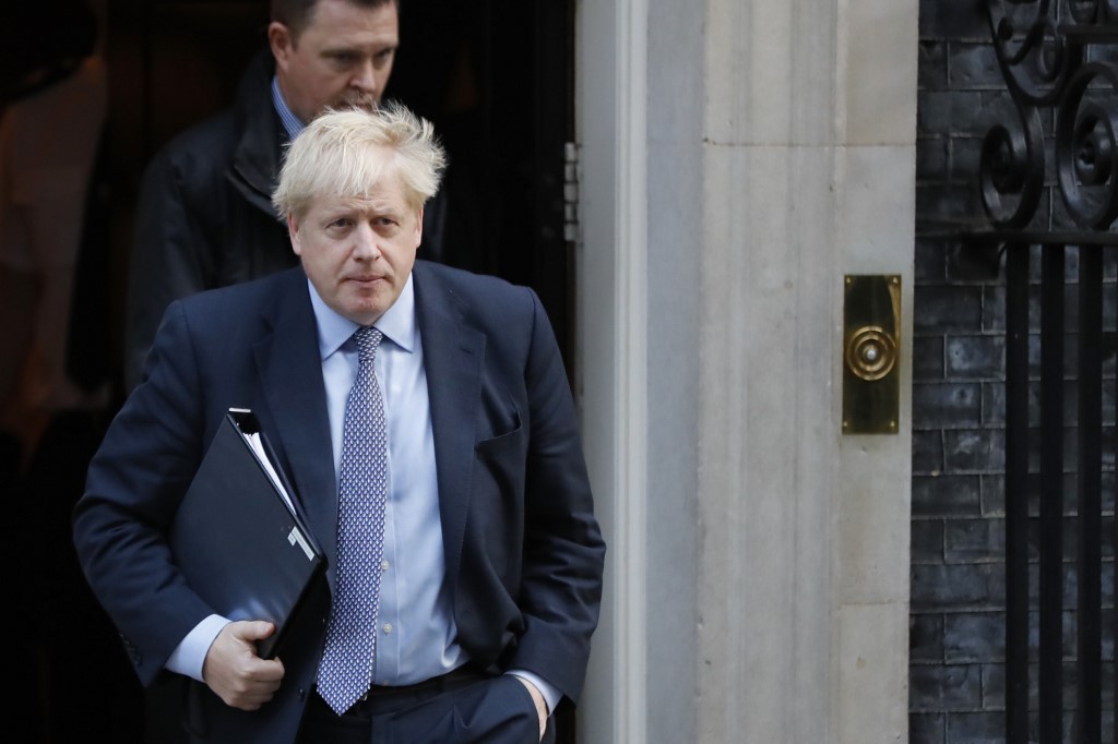 Britain's Prime Minister Boris Johnson leaves 10 Downing Street in central London on October 19, 2019. - British MPs gather on October 19 for a historic vote on Prime Minister Boris Johnson's Brexit deal, a decision that could see the UK leave the EU this month or plunge the country into fresh uncertainty. (Photo by Tolga AKMEN / AFP)