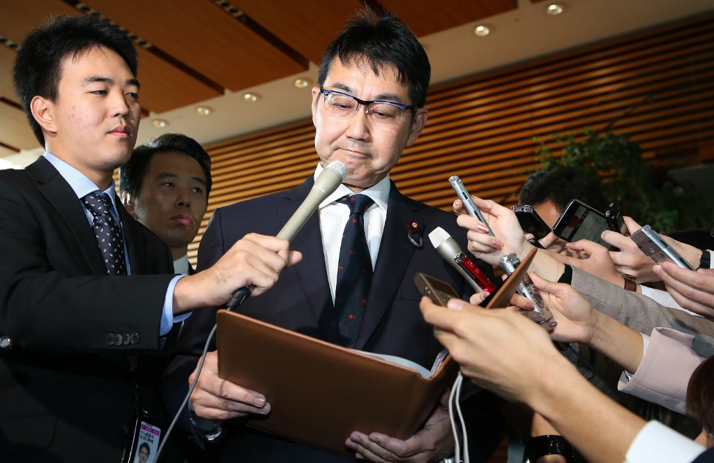 Japan's justice minister Katsuyuki Kawai speaks to journalists after submitting his resignation in Tokyo on October 31, 2019. - Japan's justice minister Katsuyuki Kawai on October 31 became the second cabinet member to quit in a week, after allegations his wife broke election law while running for a parliament seat. (Photo by STR / JIJI PRESS / AFP) / Japan OUT