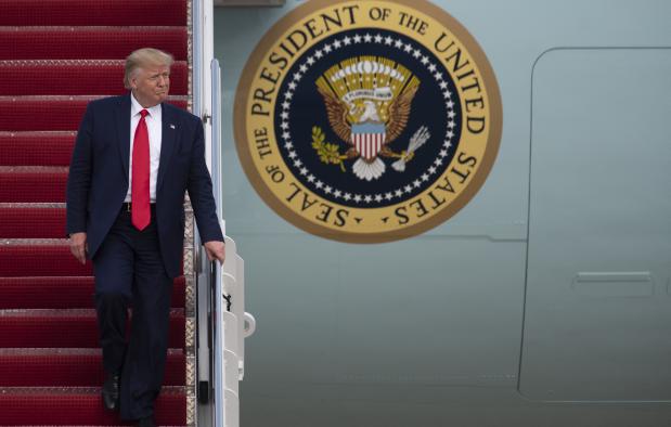 Donald Trump walks down Air Force One