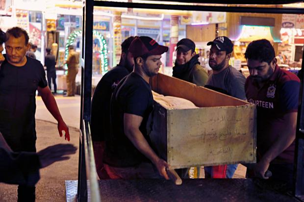 Mourners carry coffin of slain protester in Iraq