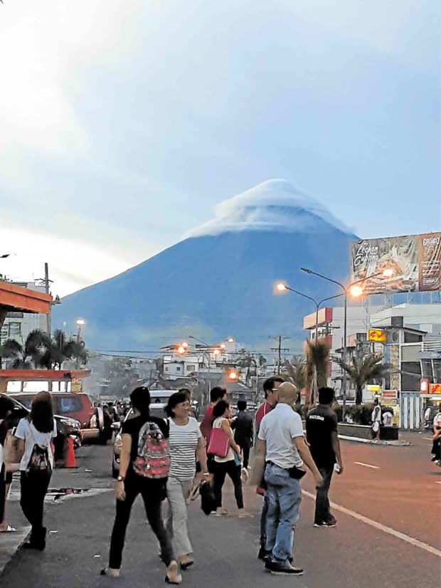‘Lovely but dangerous’ Mayon covered with lens-shaped clouds