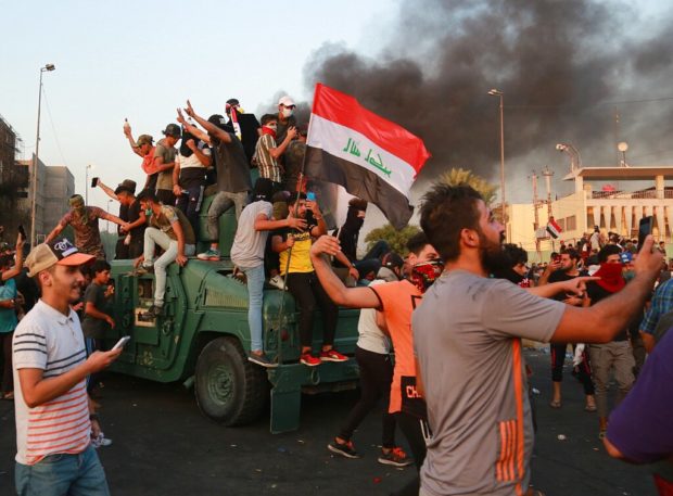 Shiite cleric warns Iraq’s leaders; protest death toll at 42