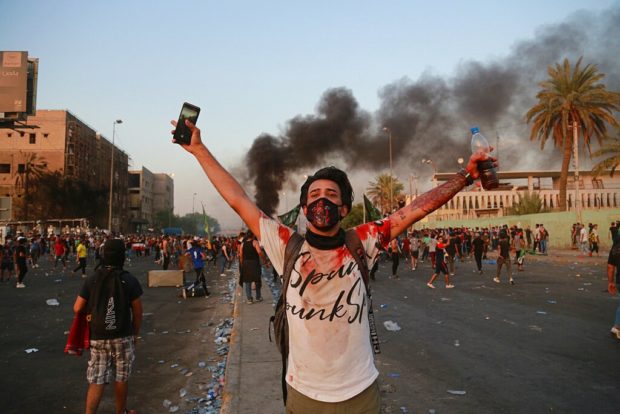 Iraqi PM addresses the nation, urges protesters to go home