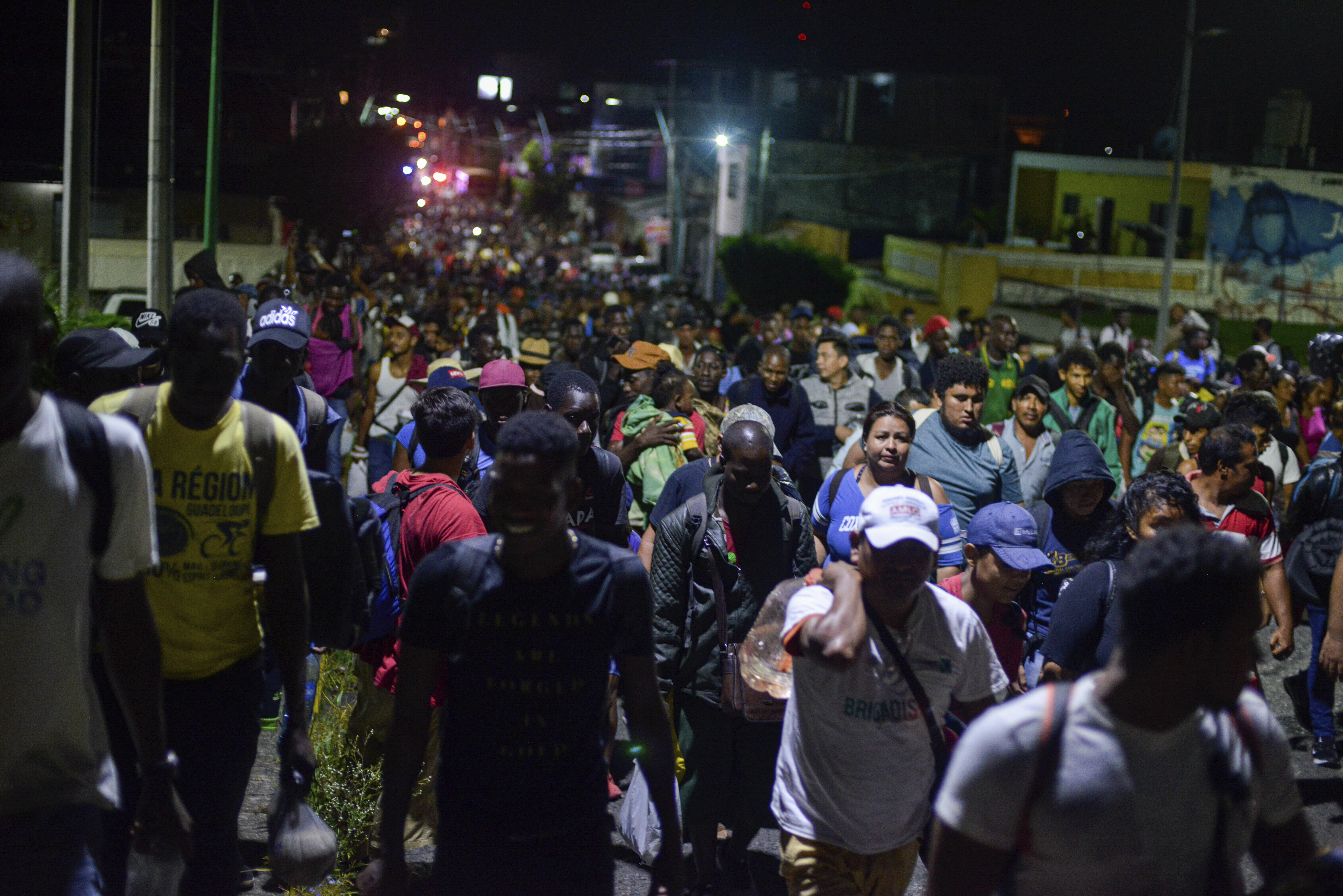 Migrants depart early in the morning from Tapachula, Chiapas state, Mexico, Saturday Oct. 12, 2019. Migrants from Africa, Cuba, Haiti, and other Central American countries set off early morning by foot from Tapachula to the southern border of the United States. (AP Photo/Isabel Mateos)