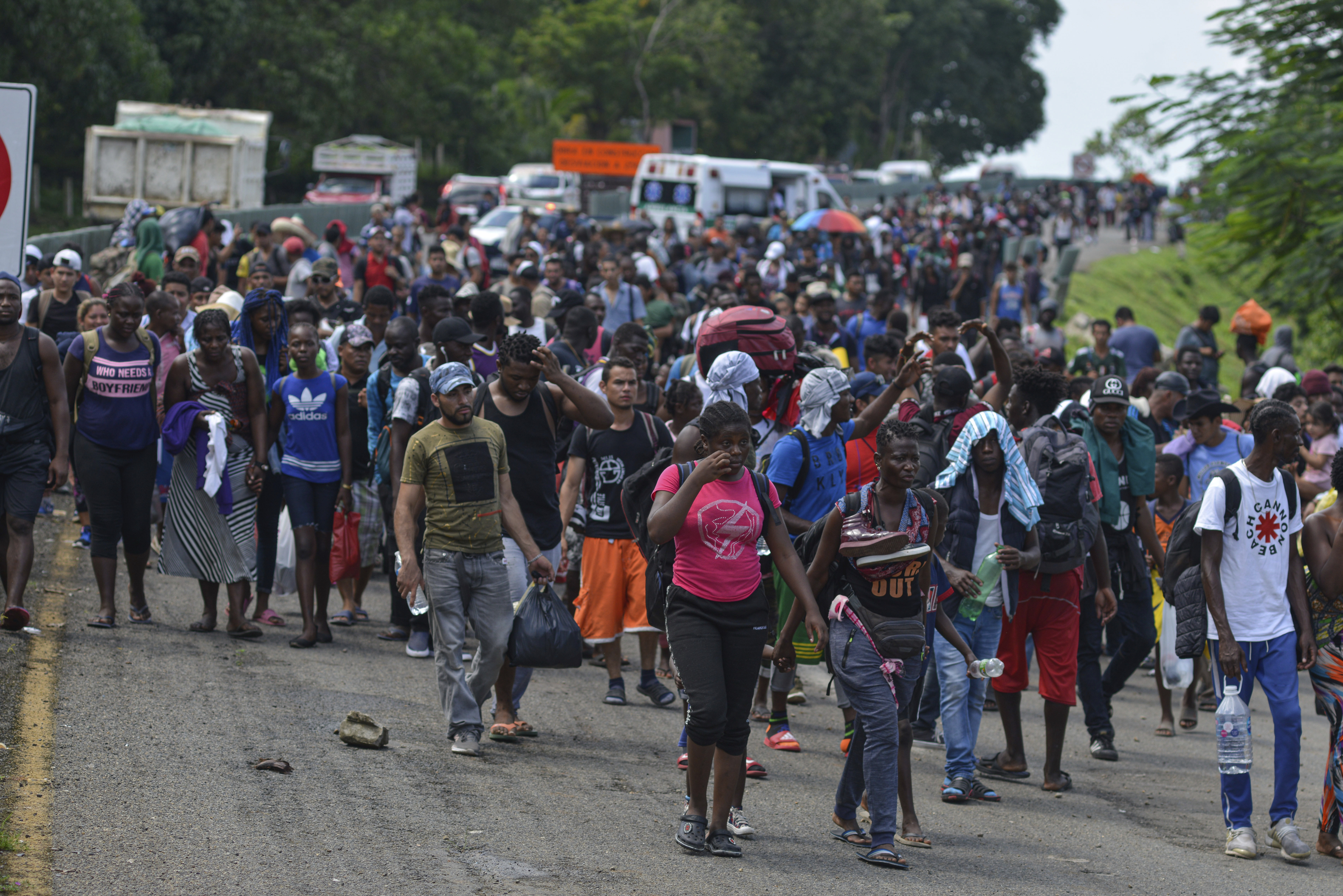 Migrants walk down Highway 200 en route to Huixtla near Tapachula, Chiapas state, Mexico, Saturday Oct. 12, 2019. Migrants from Africa, Cuba, Haiti, and other Central American countries set off early morning by foot from Tapachula to the southern border of the United States. (AP Photo/Isabel Mateos)