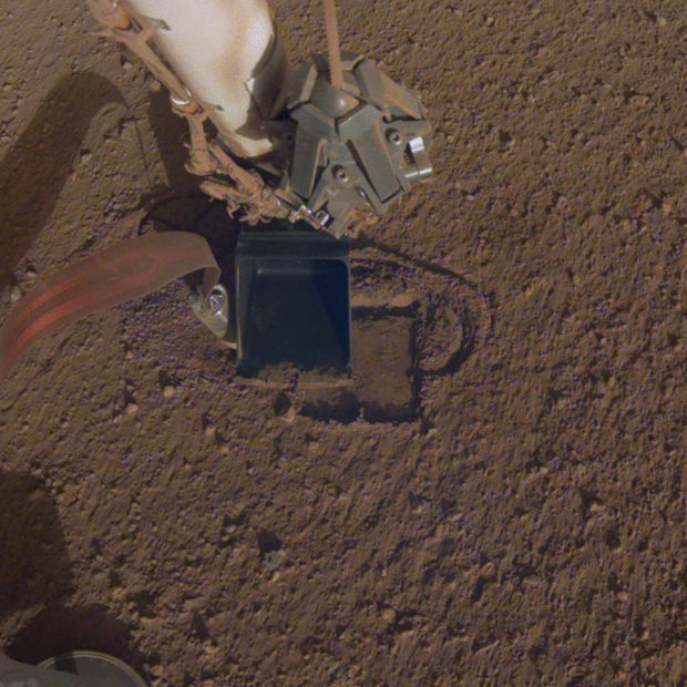 Mars lander's digger is burrowing again after snag