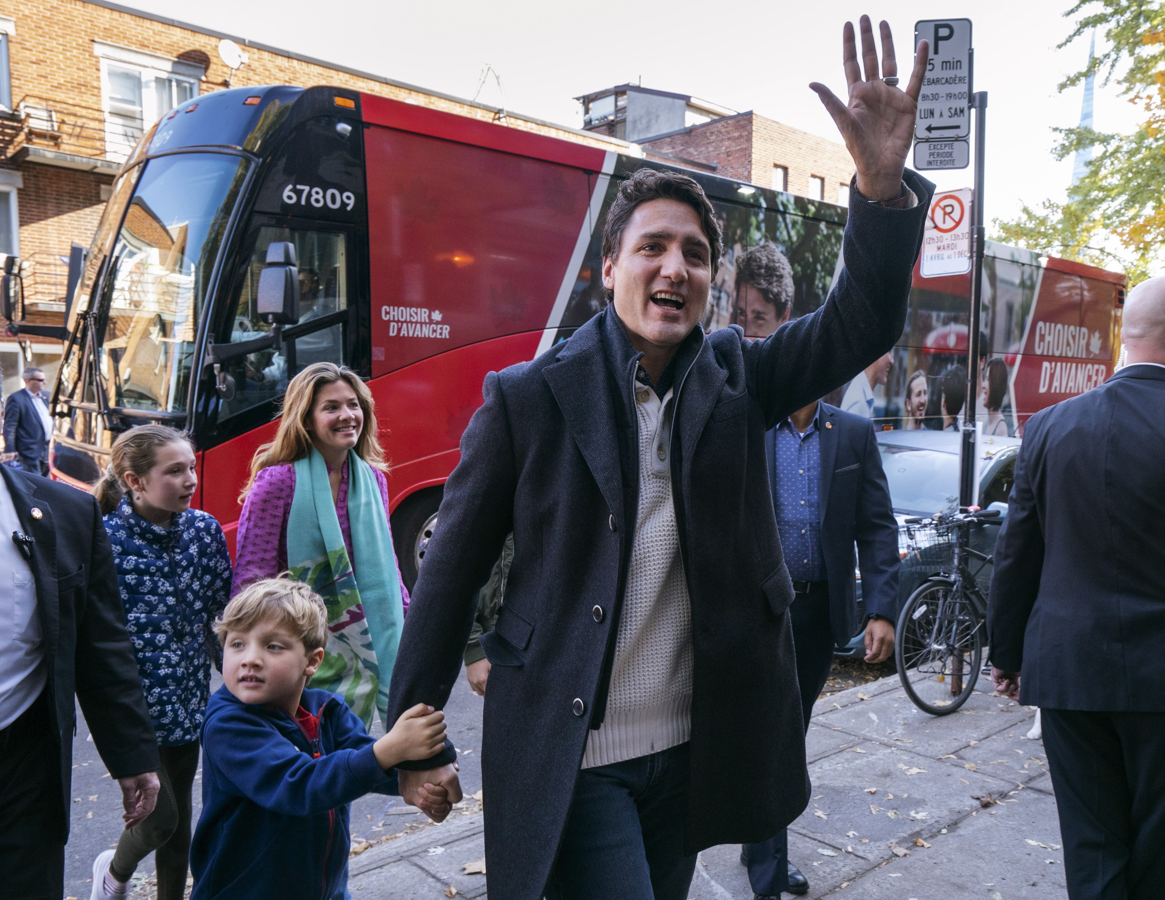 Canadian Prime Minister and Liberal leader Justin Trudeau arrives at the poling station with his son Hadrian, his wife Sophie and daughter Ella-Grace in Montreal, Monday, Oct. 21, 2019. (Paul Chiasson/The Canadian Press via AP)