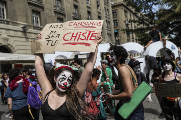  Protests rage in Chile despite president's reform promise