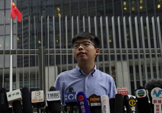 Pro-democracy activist barred from election; Hong Kong nears recession